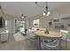 Open-concept living space showing a dining table and chairs along with the living room and access to the outdoors at 240 W End Dr # 412, Punta Gorda, FL 33950