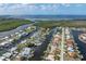Waterfront canal home with a screened pool in a neighborhood with access to ocean and private boat docks at 5430 Almar Dr, Punta Gorda, FL 33950