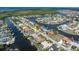 Waterfront property featuring a canal, private boat dock, and beautiful landscaping in a residential neighborhood at 5430 Almar Dr, Punta Gorda, FL 33950