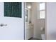 Powder room featuring a vanity with a sink, a mirror, and a toilet, conveniently located near the main living area at 5430 Almar Dr, Punta Gorda, FL 33950
