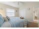 Cozy bedroom with bright natural light, crisp white walls, and neutral-toned floors and furnishings at 5430 Almar Dr, Punta Gorda, FL 33950