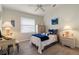 Cozy bedroom with a ceiling fan, a window bringing in natural light, and a desk, creating a peaceful retreat at 5430 Almar Dr, Punta Gorda, FL 33950