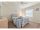 Comfortable bedroom featuring neutral walls, wood-look floors, and a ceiling fan for a relaxing atmosphere at 5430 Almar Dr, Punta Gorda, FL 33950
