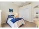 Comfortable bedroom featuring a double bed, a ceiling fan, a closet, and stylish decor at 5430 Almar Dr, Punta Gorda, FL 33950