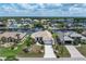 Beautiful home featuring a tile roof, lush landscaping, and waterfront views in a desirable neighborhood at 5430 Almar Dr, Punta Gorda, FL 33950