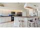 Modern kitchen featuring a breakfast bar and modern appliances at 5430 Almar Dr, Punta Gorda, FL 33950