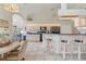 Open-concept kitchen with bar seating, tile flooring, and modern appliances at 5430 Almar Dr, Punta Gorda, FL 33950