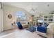 Inviting living room with large arched windows and built-in bookshelves, creating a cozy atmosphere at 5430 Almar Dr, Punta Gorda, FL 33950