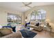 Comfortable living room with large windows and sliding doors to a screened-in patio with a pool at 5430 Almar Dr, Punta Gorda, FL 33950