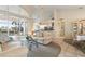 Bright living room featuring high ceilings, tile flooring, comfortable seating and a glass sliding door to the pool at 5430 Almar Dr, Punta Gorda, FL 33950