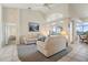 Inviting living room with sliding glass doors leading to an outdoor space with views, comfortable furnishings and decor at 5430 Almar Dr, Punta Gorda, FL 33950