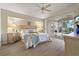 Lovely main bedroom featuring a vaulted ceiling, and access to the screened-in patio and pool at 5430 Almar Dr, Punta Gorda, FL 33950