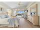 Charming main bedroom with a vaulted ceiling, and sliding glass doors to screened-in patio and pool at 5430 Almar Dr, Punta Gorda, FL 33950
