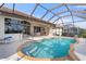 Stunning screened-in pool with multiple access points and a peaceful setting, great for swimming and leisure at 5430 Almar Dr, Punta Gorda, FL 33950