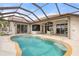Gorgeous screened-in pool with a sun-drenched patio, ideal for outdoor lounging and entertaining at 5430 Almar Dr, Punta Gorda, FL 33950
