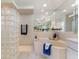 Glass block shower with tiled walls and a shower head offering a luxurious bathing experience at 5430 Almar Dr, Punta Gorda, FL 33950