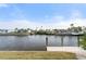 Expansive waterfront views of a tranquil canal showcasing a private boat dock at 5430 Almar Dr, Punta Gorda, FL 33950