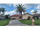 Charming single-story home with a well-manicured lawn and a unique seahorse-shaped mailbox at 674 Monaco Dr, Punta Gorda, FL 33950