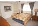 Inviting bedroom with a large window, built-in shelving, and cozy decor at 721 Brenda Ct, Punta Gorda, FL 33950