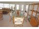 Inviting dining space with views to the living room and furnished with a bamboo table and chairs at 721 Brenda Ct, Punta Gorda, FL 33950