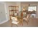 Inviting dining area featuring bamboo table and chairs next to living area at 721 Brenda Ct, Punta Gorda, FL 33950