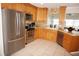Well-equipped kitchen featuring stainless steel appliances and light wood cabinetry at 721 Brenda Ct, Punta Gorda, FL 33950