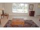 Bright living room with neutral tile flooring and views of the neighborhood at 721 Brenda Ct, Punta Gorda, FL 33950