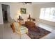 Bright living room featuring tile flooring and comfortable seating arrangement at 721 Brenda Ct, Punta Gorda, FL 33950