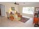 Cozy living room featuring tile floors, natural light, and comfortable seating arrangement at 721 Brenda Ct, Punta Gorda, FL 33950