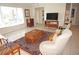 Open living room featuring tile floors, natural light, and comfortable seating at 721 Brenda Ct, Punta Gorda, FL 33950