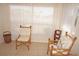 Sunny sitting area featuring bamboo chairs and a view of the outside at 721 Brenda Ct, Punta Gorda, FL 33950