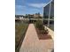 Landscaped yard with a brick walkway leads to the canal at 721 Brenda Ct, Punta Gorda, FL 33950