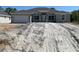 Charming single-story home featuring a two-car garage and craftsman-style details, set on a spacious lot at 17433 Edgewater Dr, Port Charlotte, FL 33948