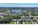 Stunning aerial view showcasing a community with a scenic lake and lush greenery, a tranquil setting at 18395 Edgewater Dr, Port Charlotte, FL 33948
