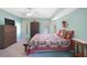 Comfortable bedroom with neutral carpet, ceiling fan, and window at 18395 Edgewater Dr, Port Charlotte, FL 33948