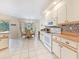 Bright dining area featuring tiled floors, a chandelier, dining table, and view of the outdoors at 18395 Edgewater Dr, Port Charlotte, FL 33948