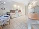 Bright eat-in kitchen featuring white appliances, tile backsplash, and tile floors at 18395 Edgewater Dr, Port Charlotte, FL 33948