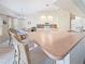 Bright kitchen featuring tile flooring, and breakfast bar with barstool seating at 18395 Edgewater Dr, Port Charlotte, FL 33948