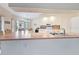 Bright eat-in kitchen featuring white appliances, tile backsplash, and tile floors at 18395 Edgewater Dr, Port Charlotte, FL 33948