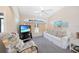 Welcoming living room featuring a comfortable seating arrangement and large window providing plenty of natural light at 18395 Edgewater Dr, Port Charlotte, FL 33948