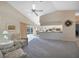 Open-concept living room features plush carpeting and sliding glass doors to the lanai at 18395 Edgewater Dr, Port Charlotte, FL 33948