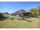 Large screened-in patio with plenty of space for outdoor dining and lounging, perfect for entertaining at 18395 Edgewater Dr, Port Charlotte, FL 33948