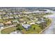 Aerial shot of a residential neighborhood, showcasing the community's layout and nearby lake at 2137 Onondaga Ln, Punta Gorda, FL 33983