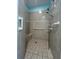 Accessible bathroom features tile, shower seat, and grab bars at 24157 Green Heron Dr # 27, Punta Gorda, FL 33980