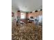 Spacious kitchen featuring granite countertops, stainless appliances, and ample cabinet storage at 24157 Green Heron Dr # 27, Punta Gorda, FL 33980