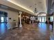Inviting lobby with decorative chandeliers, tile flooring, and comfortable seating arrangements at 24157 Green Heron Dr # 27, Punta Gorda, FL 33980