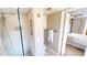Modern bathroom featuring a sleek glass shower and a convenient entrance to the bedroom at 3830 Bal Harbor Blvd # 5, Punta Gorda, FL 33950