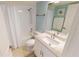 This bathroom has a shower-tub combo, a white vanity, tile floors, and a standard toilet at 3830 Bal Harbor Blvd # 5, Punta Gorda, FL 33950