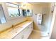 This bathroom features a single sink vanity with granite countertops, a window, and glass enclosed shower at 3830 Bal Harbor Blvd # 5, Punta Gorda, FL 33950