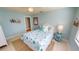 This light and airy bedroom features cool tones, tile floors, and comfortable furniture at 3830 Bal Harbor Blvd # 5, Punta Gorda, FL 33950